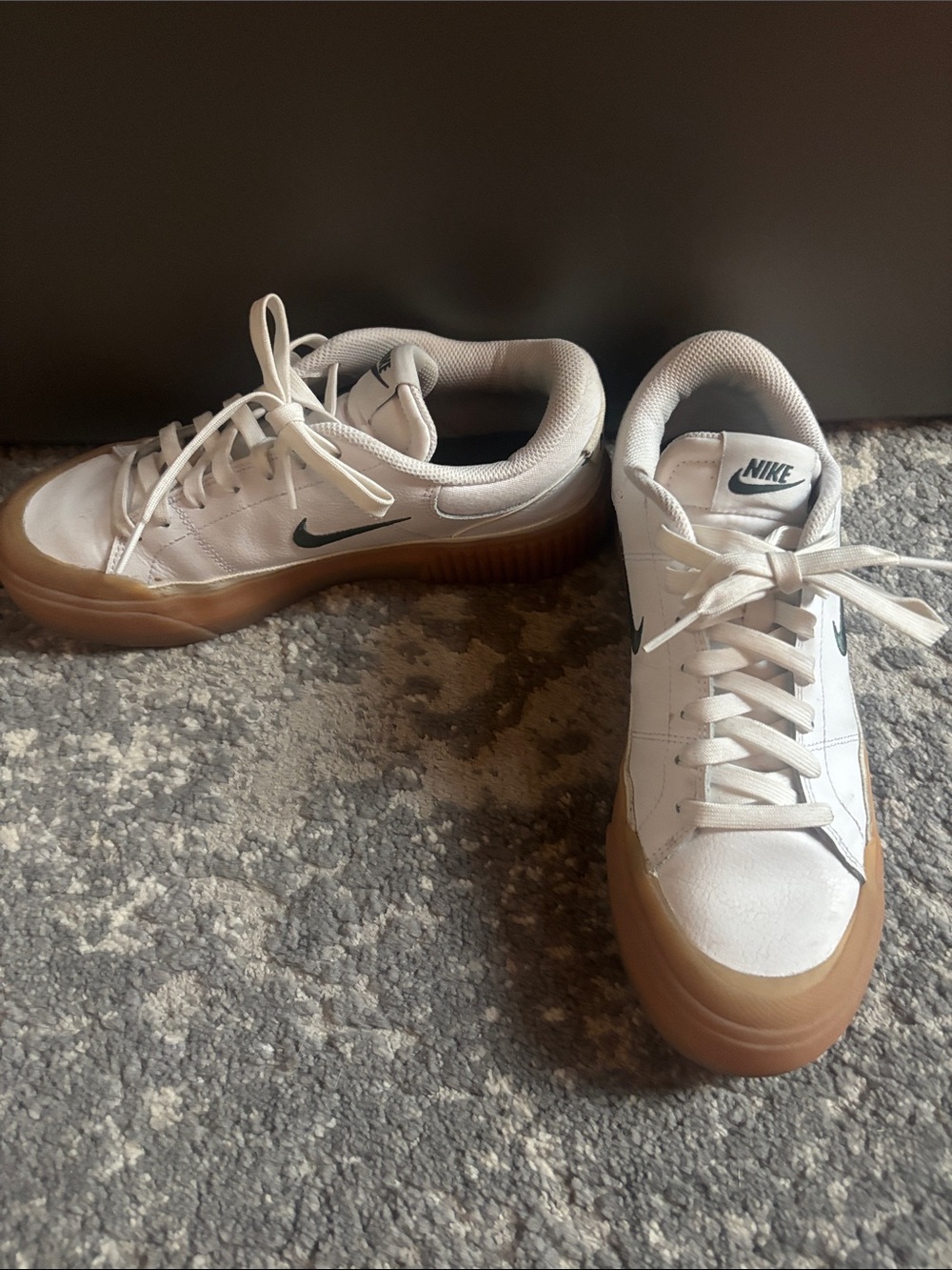 Nike White Sneakers with Black Swoosh and Gum Sole